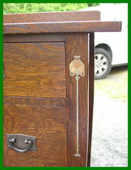 Close-up of pewter, copper and curly maple inlay on leg.